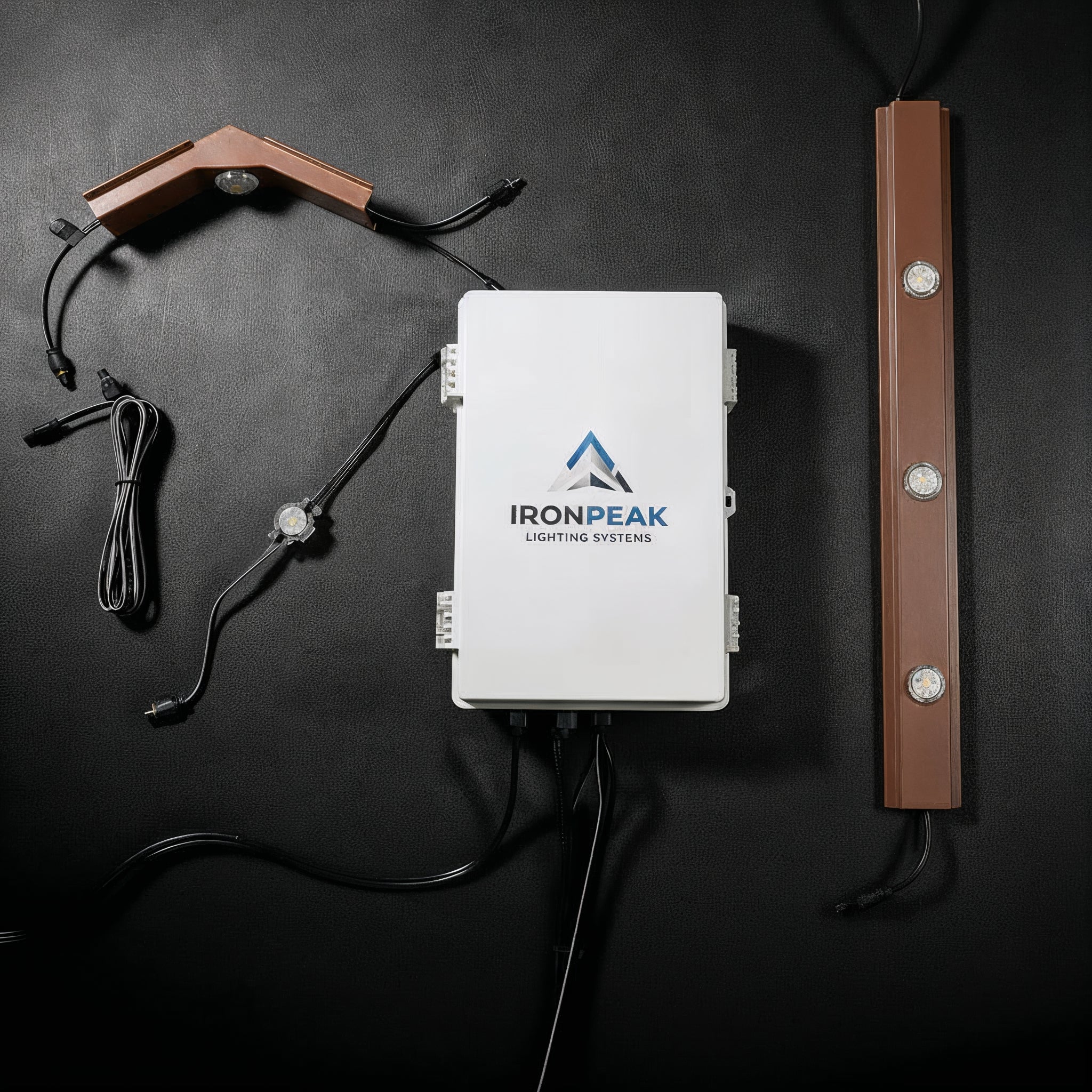 300 ft Full-Perimeter Kit — controller, track runs and three pre-built Apex peaks on a dark studio background